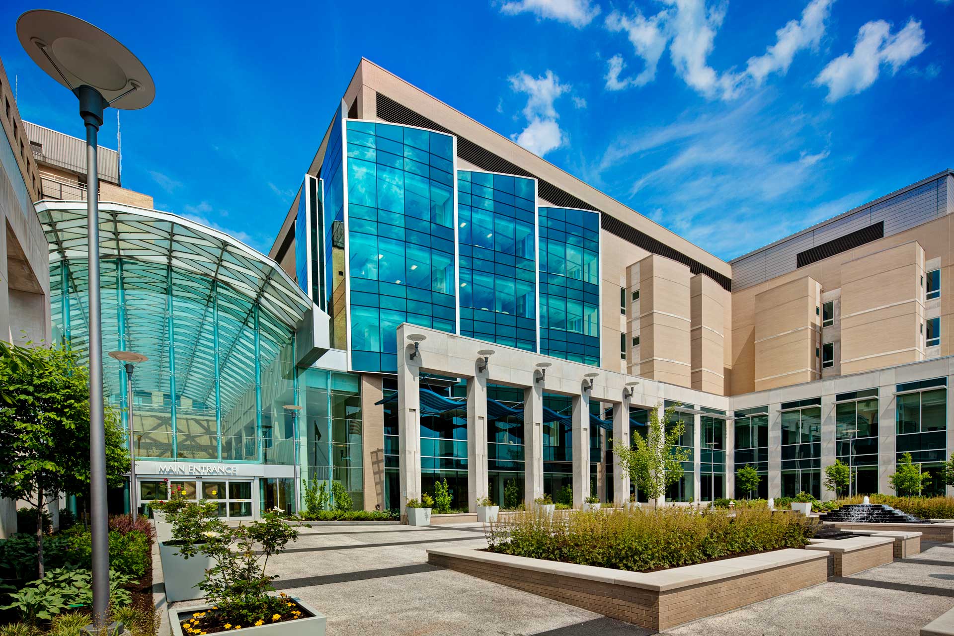 Hospital entryway exterior image with lots of glass windows